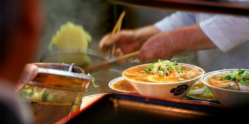 Chef preparing Ramen at Tsukiji Fish Market in Tokyo