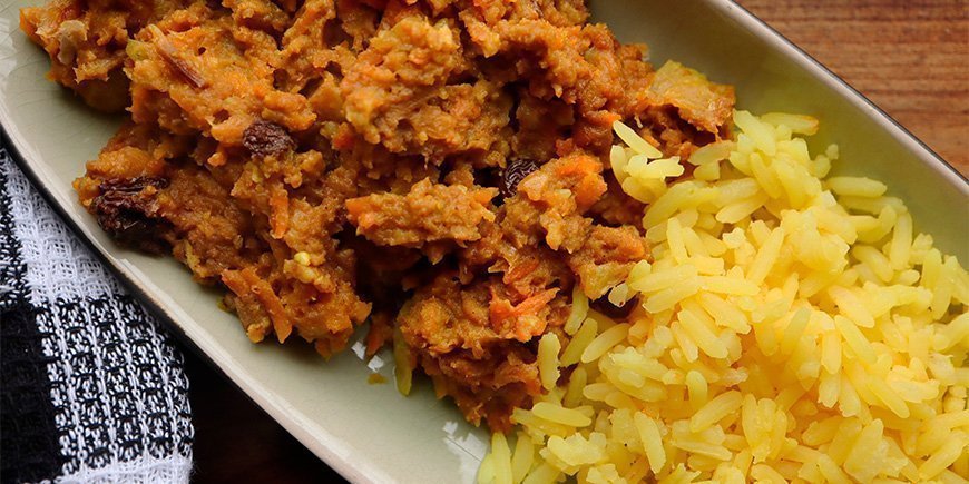 South African dish, Bobotie, served with yellow rice
